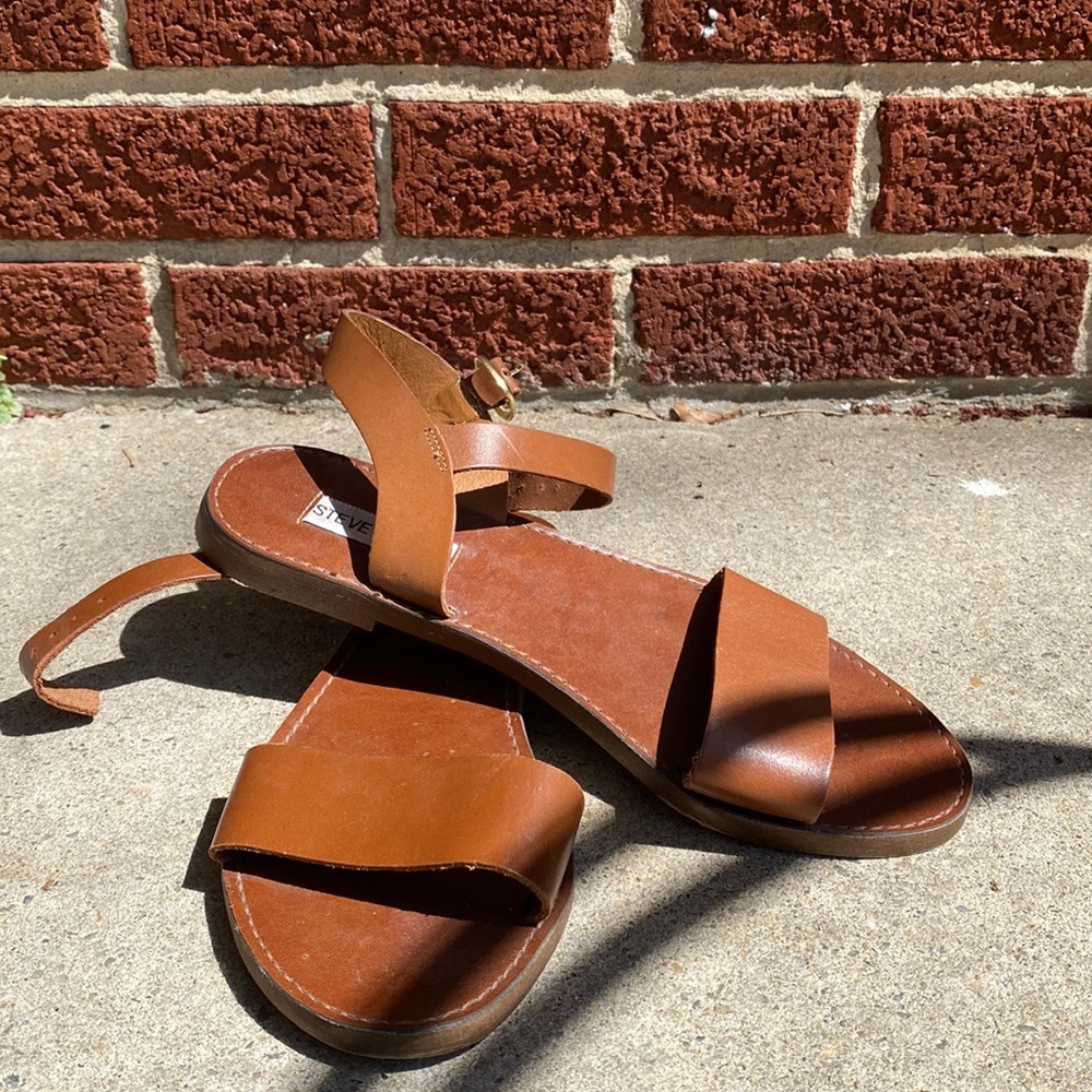 {Steve Madden } tan flats.